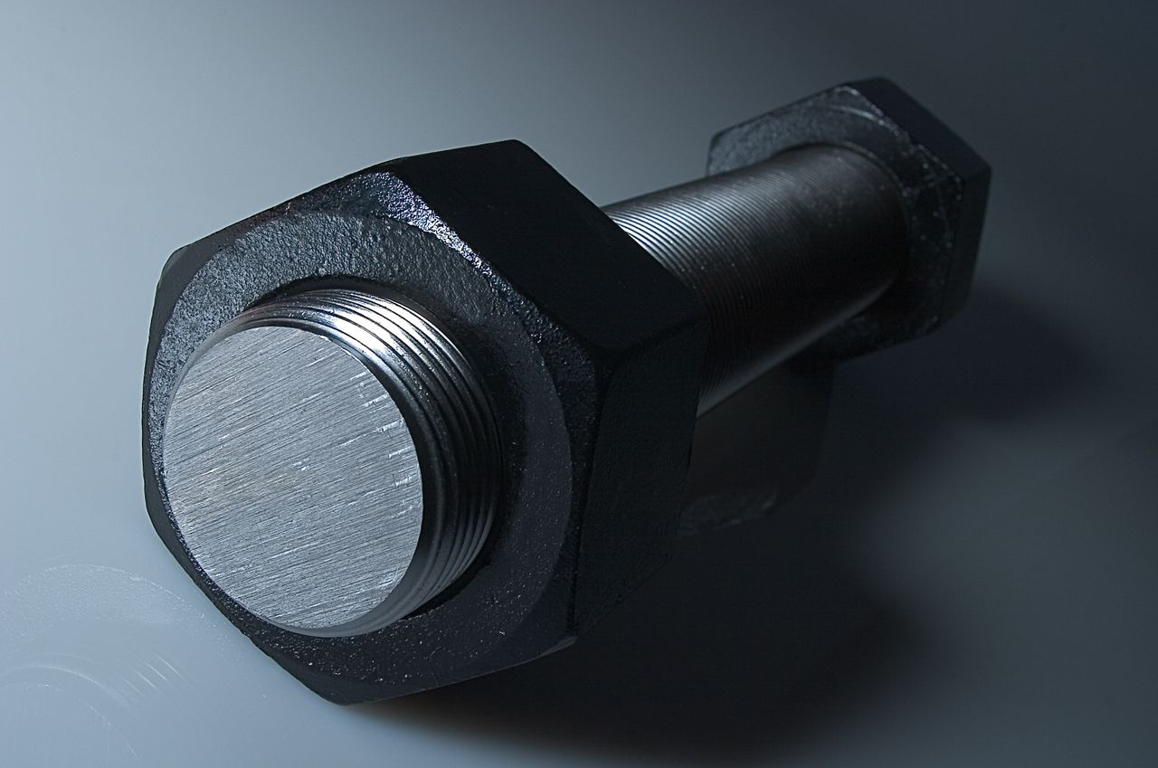 Detailed view of a large metal bolt showcasing texture and design in steel.